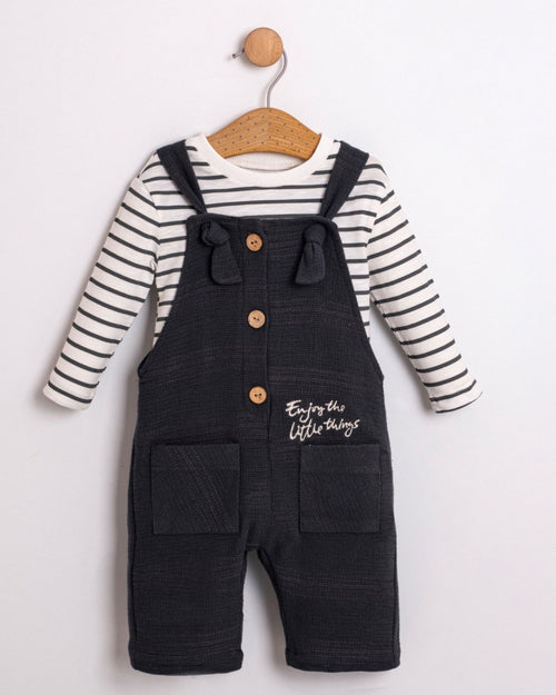 Baby boy navy dungarees with tie straps over a striped long-sleeve top, front view