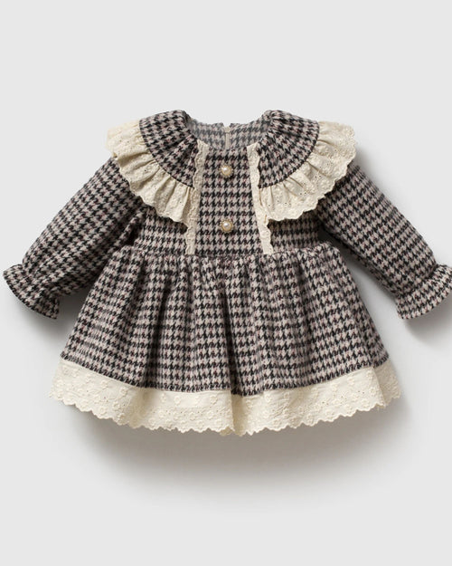 Baby girl black and ivory houndstooth dress with lace ruffle collar, front view
