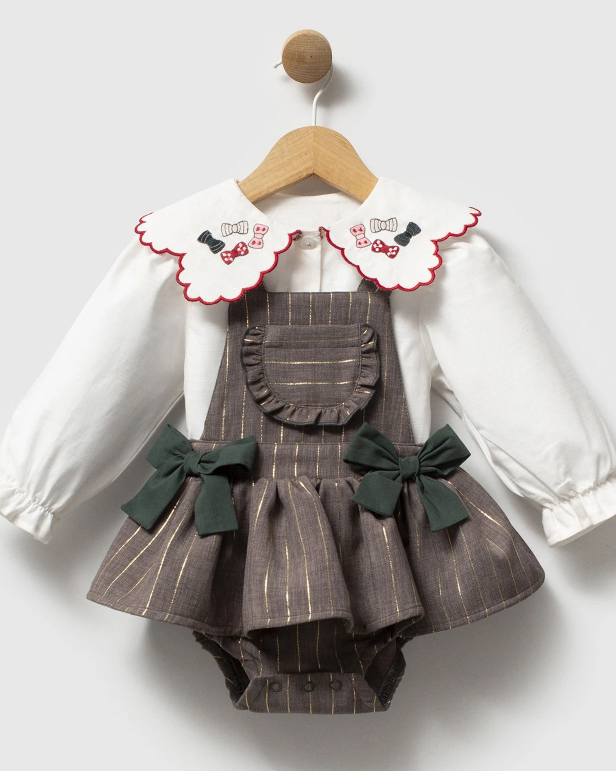 Baby girl grey pinstripe pinafore romper with green bows over ivory collar blouse, front view