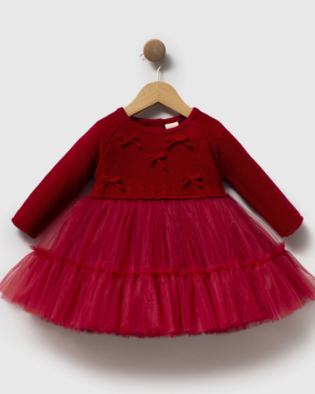 Baby girl red party dress with knitted bodice and tiered tulle skirt, front view on hanger