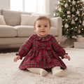 Baby girl red tartan Christmas dress with frilled collar and bow, front view on hanger