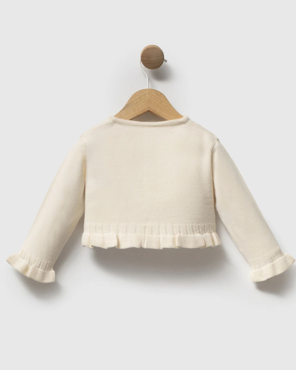 Back view of cropped cream knit baby cardigan