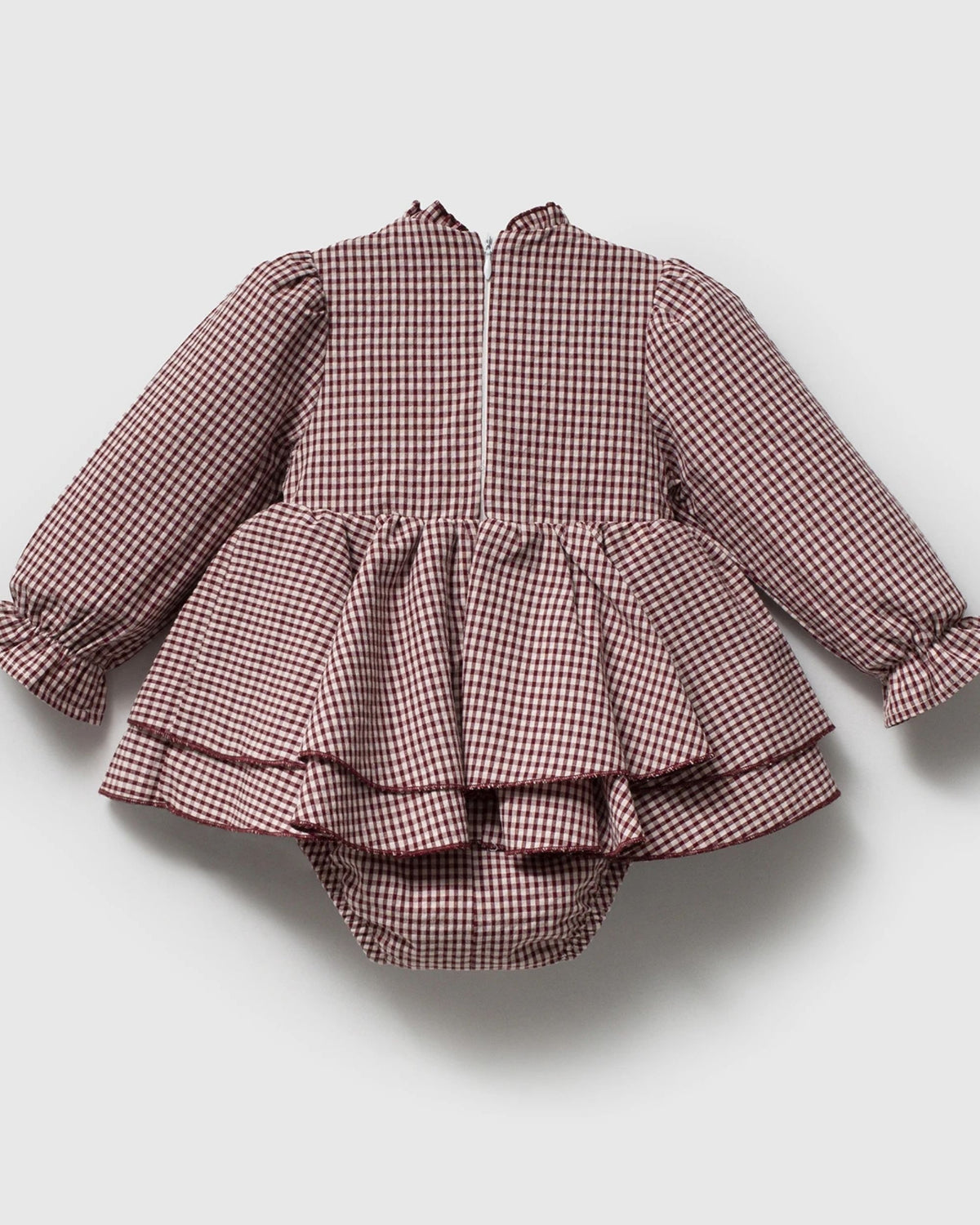 Back view of pink gingham baby romper dress with built-in bloomers