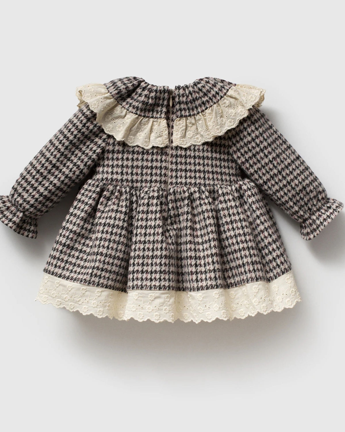 Back view of black houndstooth baby dress with gathered skirt