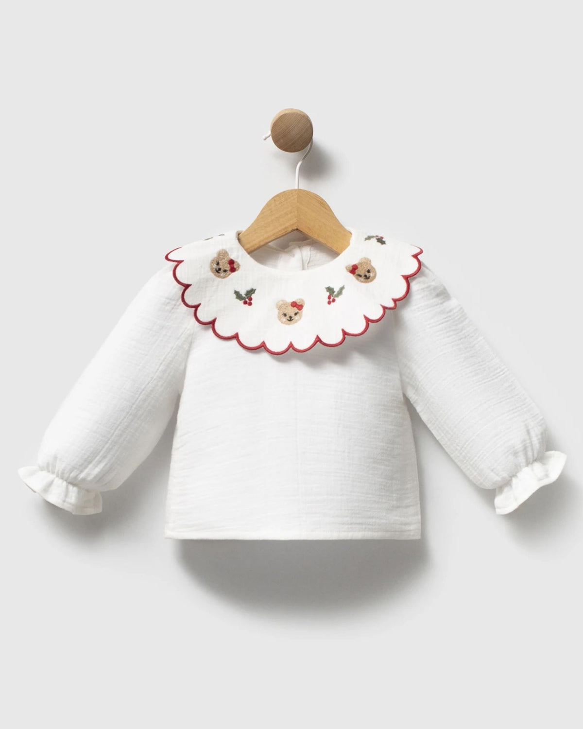Ivory cotton baby blouse with scalloped red-edged collar and frilled cuffs