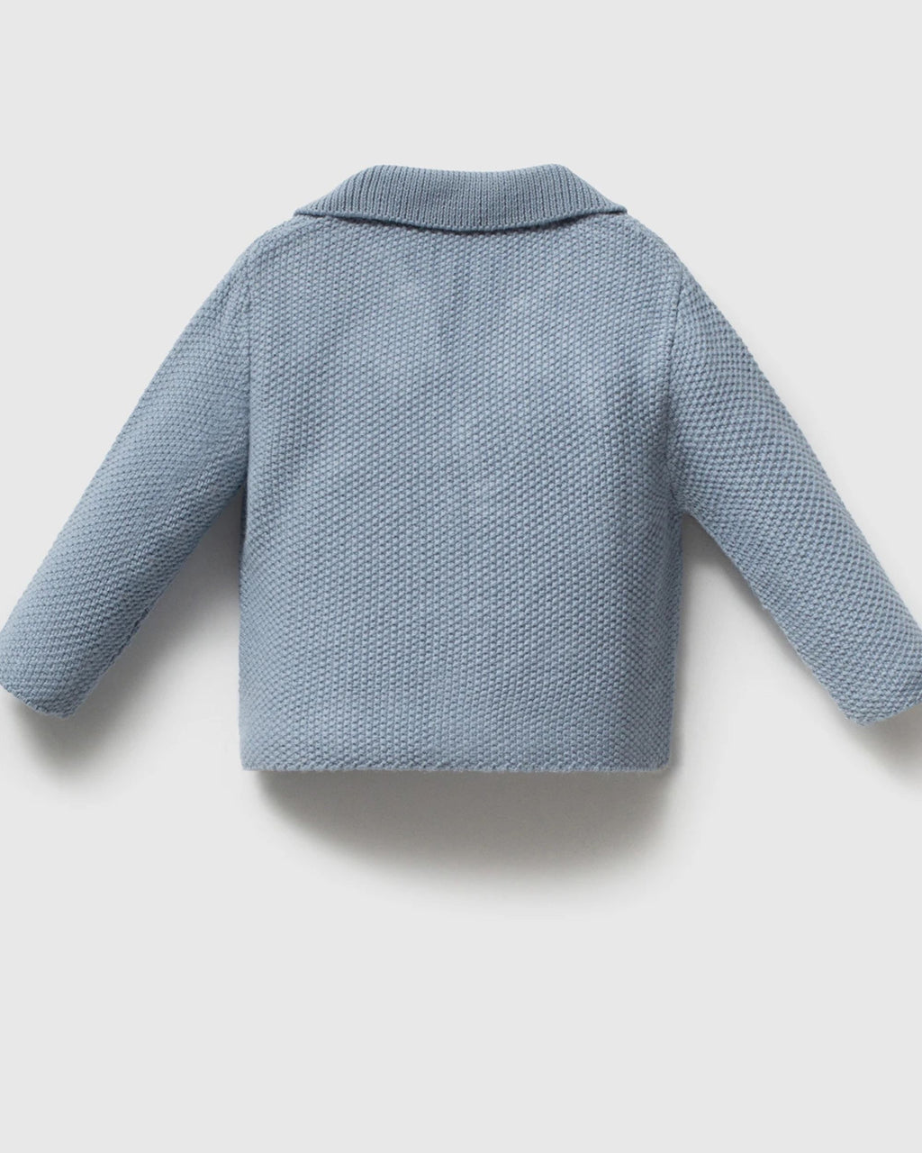 Close-up of knit texture and buttons on a baby boy blazer