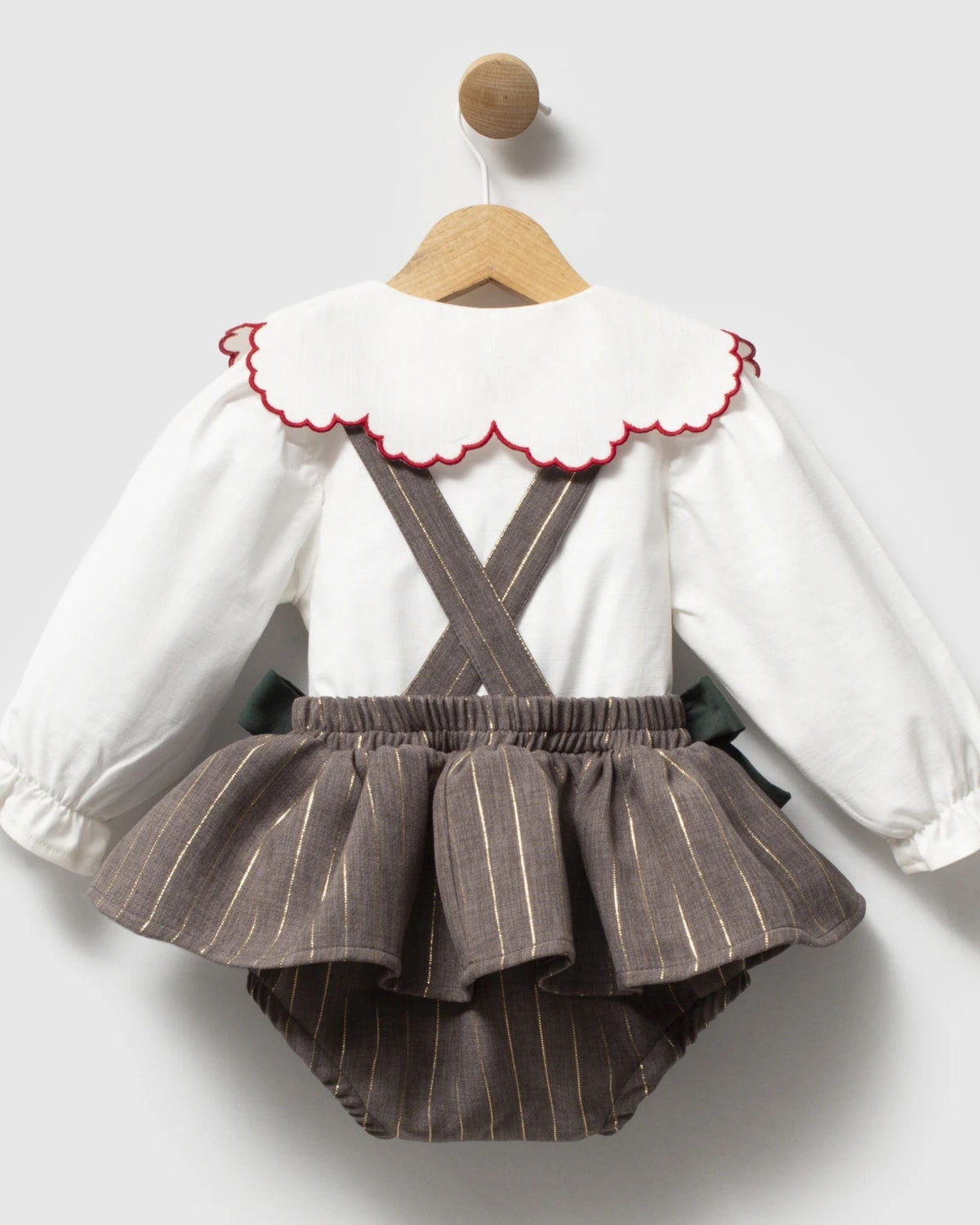 Back of grey baby pinafore romper with cross-back braces
