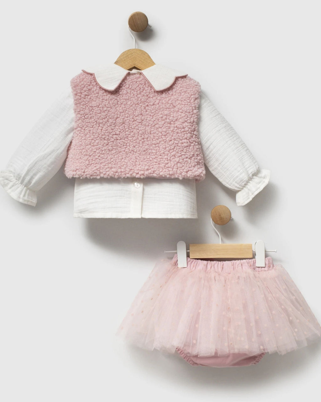 Dusty pink fluffy sherpa gilet for a baby girl
