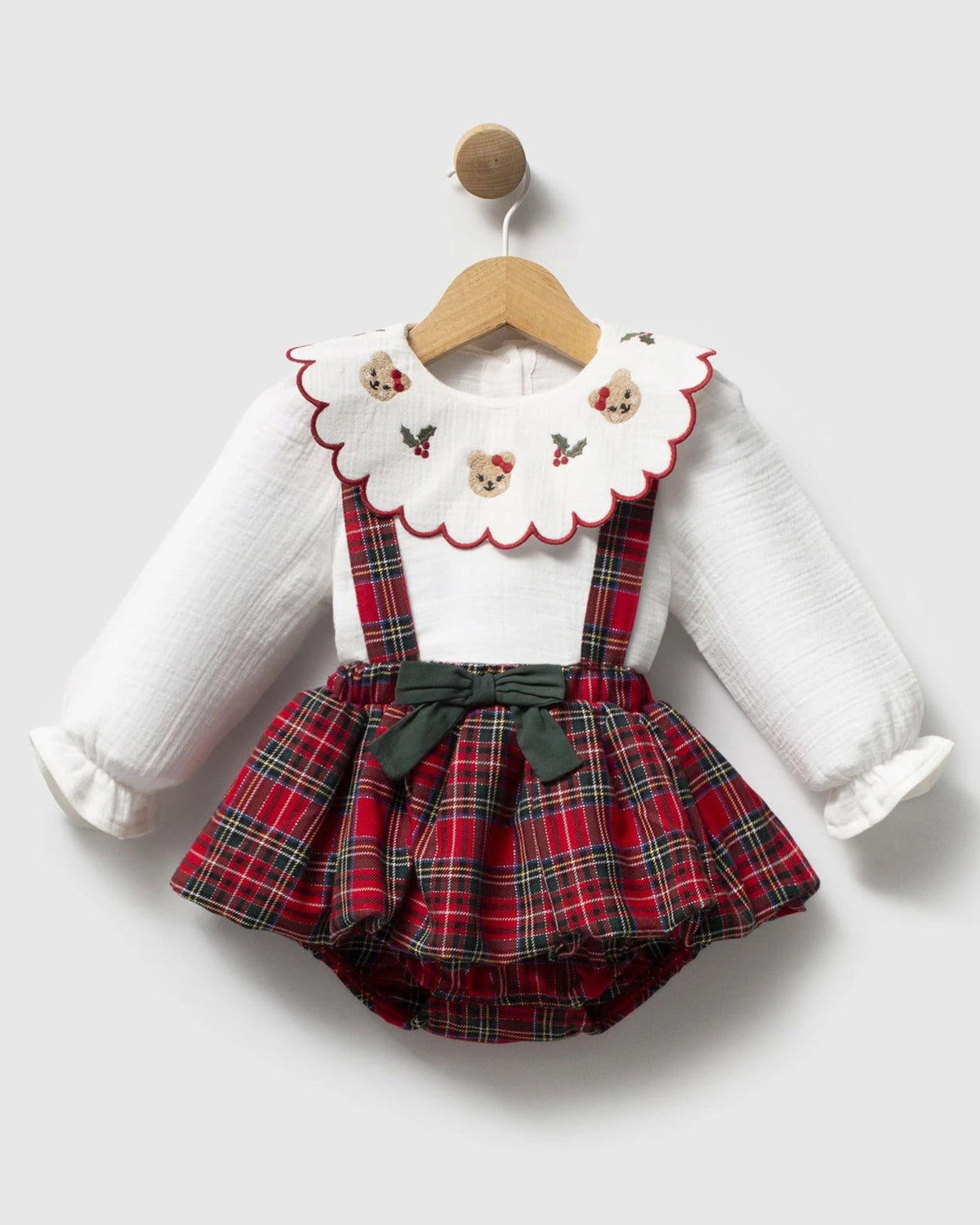 Red tartan baby bubble romper with green bow and cross-back braces