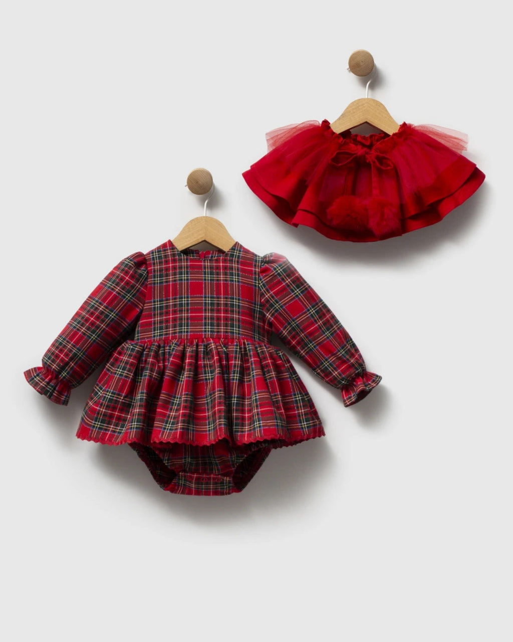 Picot-edged hem and built-in bloomers of a tartan baby romper dress